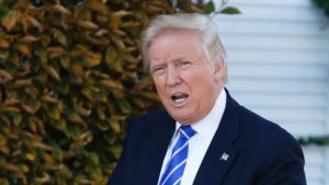 FILE - In this Saturday, Nov. 19, 2016 file photo, President-elect Donald Trump gives the thumbs-up as he arrive at the Trump National Golf Club Bedminster clubhouse in Bedminster, N.J. Los Angeles Mayor Eric Garcetti and Trump talked about immigration, infrastructure and the Olympics in their first phone call since the election. Garcetti's Press Secretary Connie Llanos says the Democrat Garcetti and the Republican Trump had a productive phone conversation on Wednesday, Nov. 23, 2016. (AP Photo/Carolyn Kaster, File)